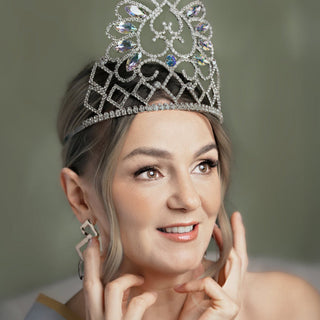 Woman wearing a sparkling tiara with a blurred background