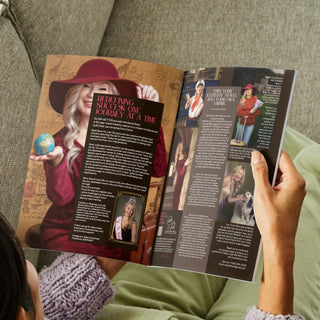 Person reading a magazine on a couch