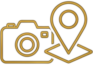 Icon of a camera and map pin in gold on a white background